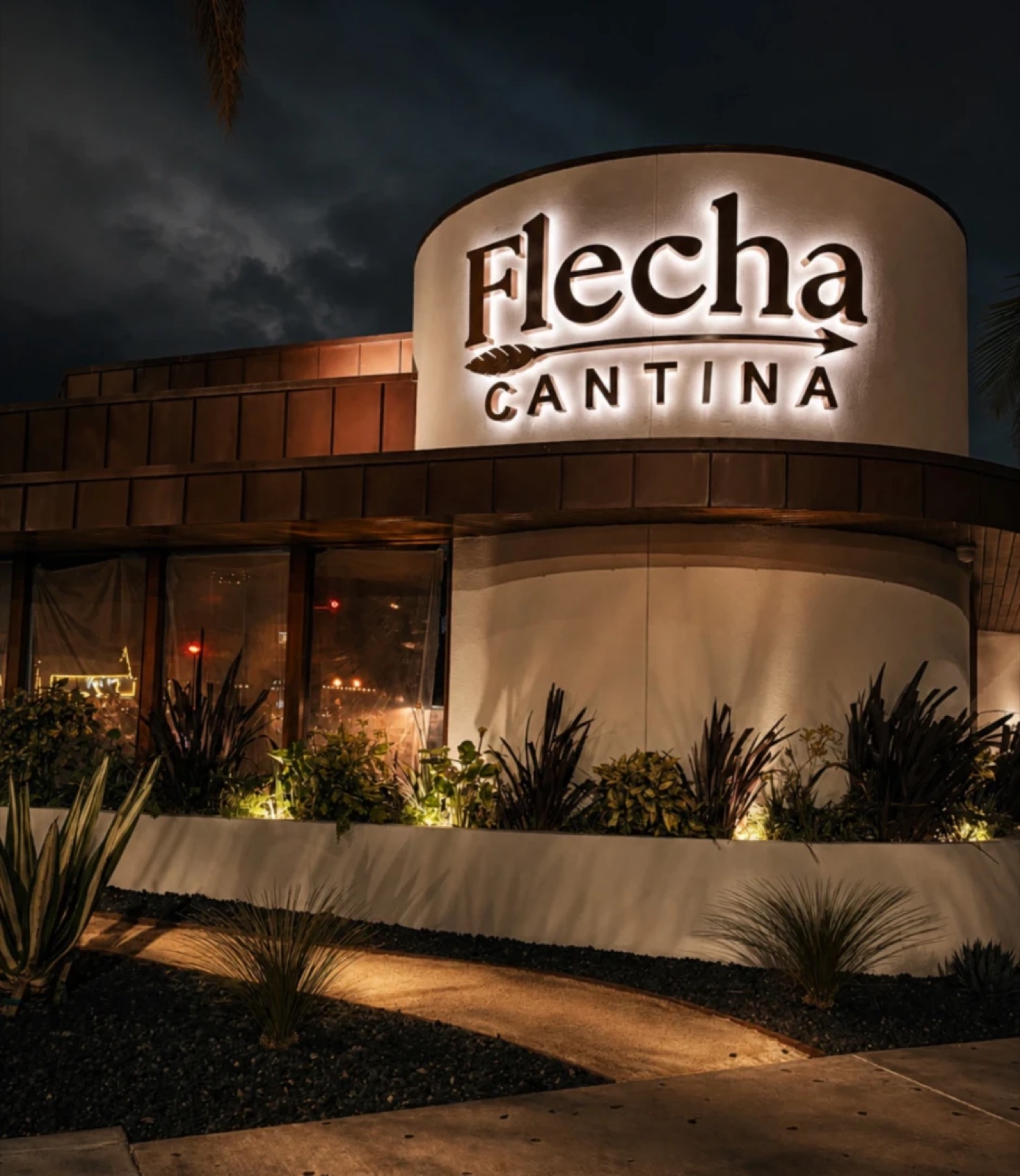 Flecha Cantina on West Coast Highway in Newport Beach, its sign glowing at night